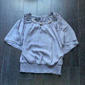 Woman’s fancy gray blouse
